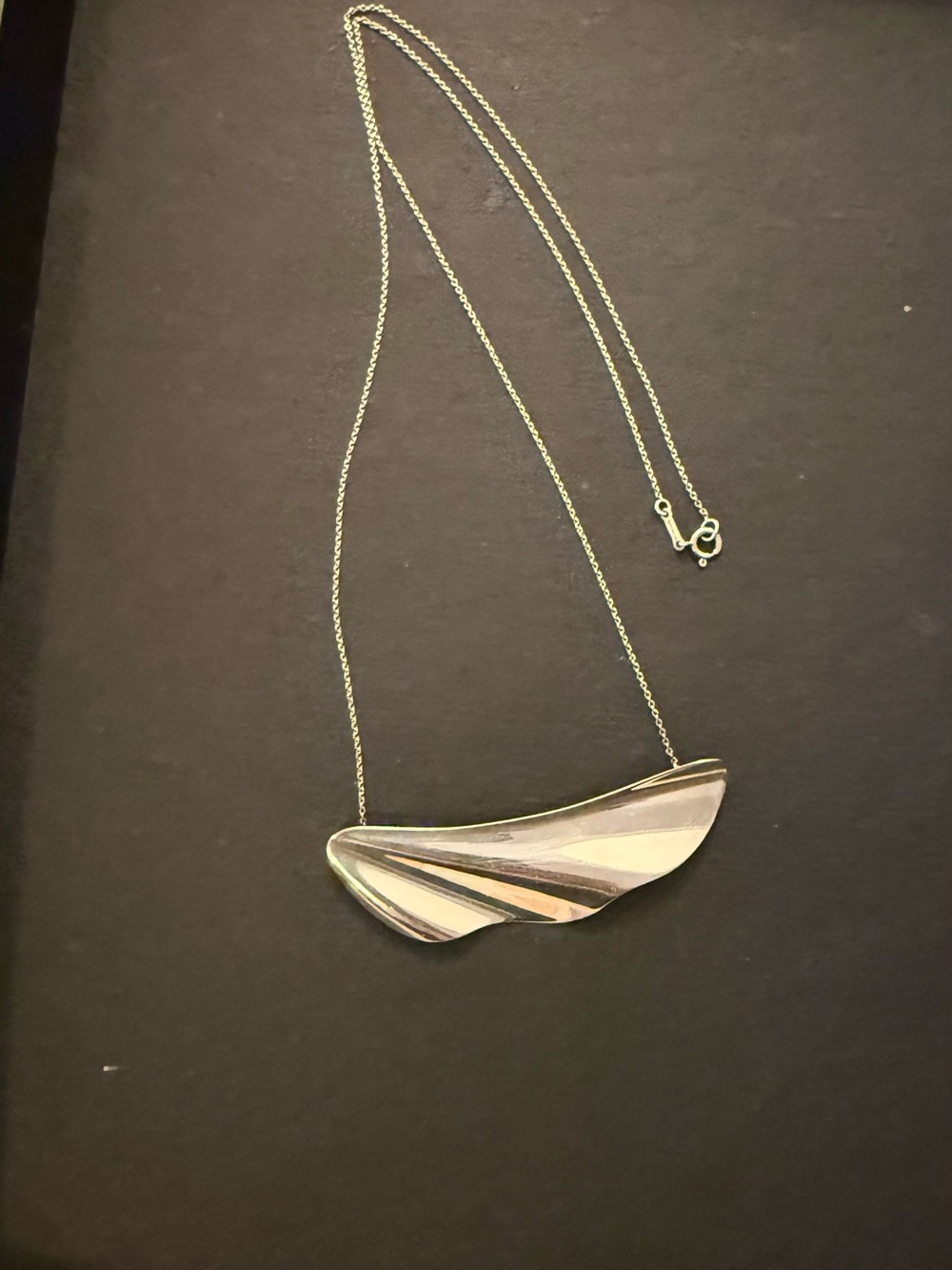 Tiffany & Co. Elsa Peretti High Tide necklace is crafted from sterling silver